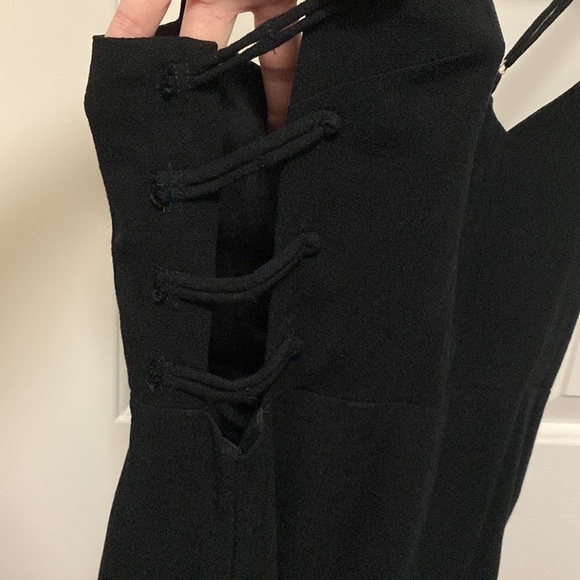 Beautiful black romper! Has cute side detailing in both sides! Only worn 2 times - Picture 2 of 4